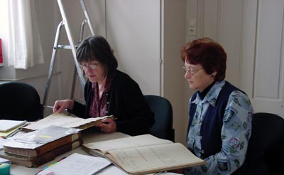 Nancy and Pat working through church book in Neckarelz